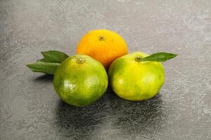 Three oranges and one lemon photo