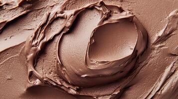 Chocolate frosting spread elegantly across a surface, showcasing creamy texture and rich color in a close-up view photo