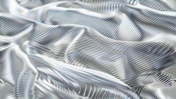 A close up of a silver fabric with wavy lines photo
