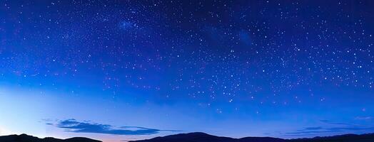 The night sky is filled with stars and the moon photo