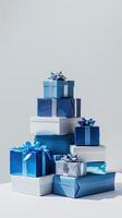A pile of blue gift boxes on a white background photo