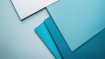 A blue and white paper background with different shapes photo