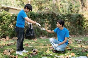 Collaboration and Teamwork in Environmental Cleanup. Young volunteers exchanging responsibilities during a community clean-up. photo