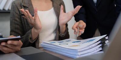 Professional Consultation and Data Analysis. A finance team analyzing key performance indicators and business trends. photo