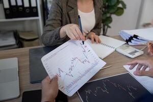 Data Visualization and Strategy. A business meeting featuring detailed charts and graphs for in-depth strategy discussion. photo