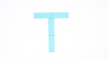 Letter T from blue color wood block isolated on white background photo
