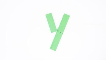 Letter Y from green color wood block isolated on white background photo