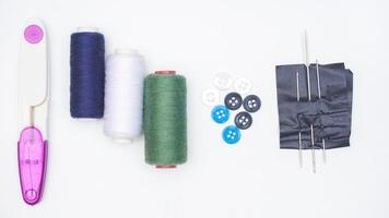 Set of sewing supplies and tools isolated on white background photo