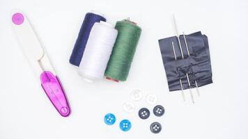 Sewing supplies and tools isolated on white background photo