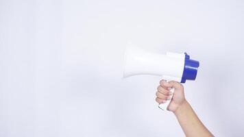 Hand with megaphone isolated on white background photo