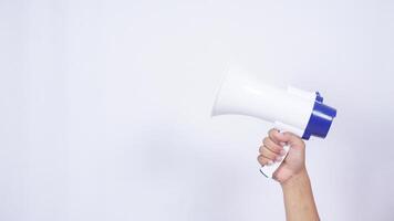 Close up of hand holding megaphone isolated on white background photo