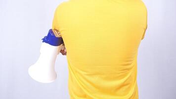 Rear view of man holding megaphone isolated on white background photo