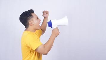 Side view of Asian man demonstrate with megaphone isolated on white background photo