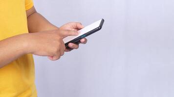Man scrolling mobile phone blank screen mock up isolated on white background photo