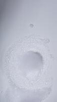 White bubbles foam isolated on white background photo