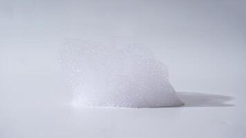 Soap foam isolated on white background photo