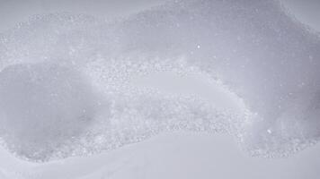 Soap foam with bubbles isolated on white background photo