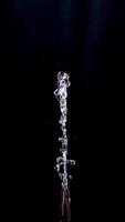 Abstract shape of water splash isolated on black background photo