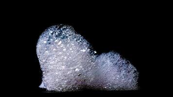 Abstract bubbles foam texture isolated on black background photo