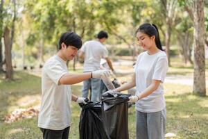 Volunteers engaging in a community cleanup, collecting trash in a park setting. photo