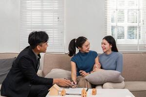 Joyful Consultation. A real estate agent and two clients share a moment during a property discussion, boosting engagement and trust. photo