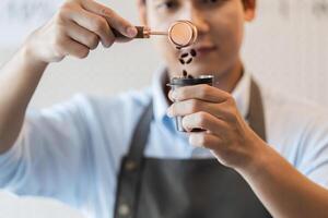 Precise Coffee Handling A barista measuring coffee beans with focus and skill. photo