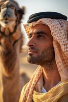 Arab man in desert with camel photo