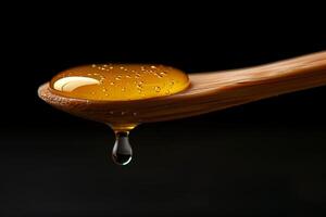 A spoon with honey dripping from it photo