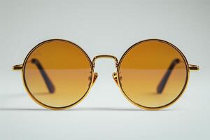 Sunglasses with gold frames and brown lenses photo