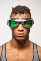 A man wearing goggles with green lenses photo