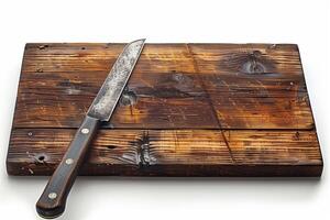 A knife on a wooden cutting board photo