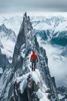 A man standing on top of a mountain with snow photo