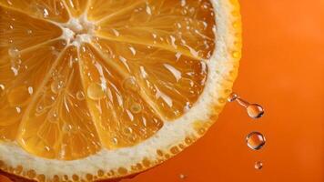 Juicy Orange Slice Close-Up with Water Drops on Vibrant Background for Food Bloggers and Recipe Websites photo