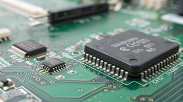 Microchip Detailed Close-Up on Circuit Board for Electronics Enthusiasts and Engineers Seeking High-Quality Tech Imagery for Projects and Presentations photo