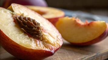 Juicy peach halves beautifully sliced on rustic wooden table for food bloggers and recipe enthusiasts photo