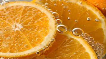 Orange slices with sparkling water bubbles in a refreshing drink for food bloggers and recipe creators photo