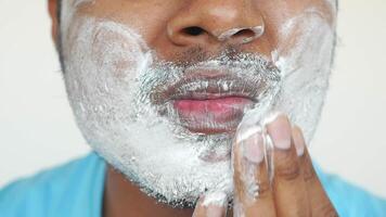 Shaving routine demonstration for a clean look at home video