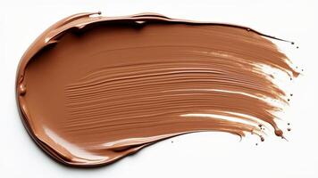 A smear of Mocha Mousse paint on a white isolated background. photo