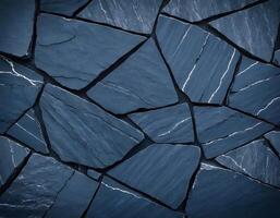 Black and dark stripy blue cracked layers of stone. Ideal for nature, geology projects photo