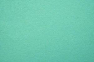 Full frame shot of light green paper sheet texture and background. photo