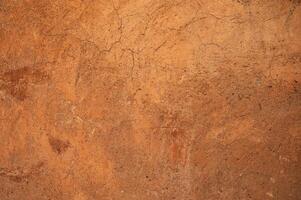 Full frame shot of an earthen wall texture of clay house structure. photo