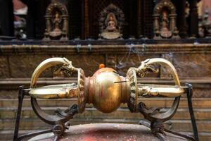 A Golden Vajra the symbol of Indra weapon in Golden temple, Patan, Nepal. photo
