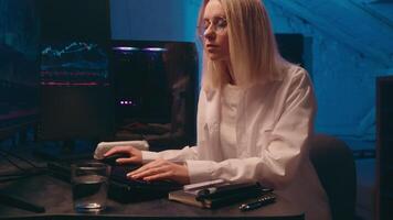 Computer late night work online crypto trading chart Caucasian business woman programmer hacker coder businesswoman broker trader thinking analyzing bitcoin price cyber security e-business investment video