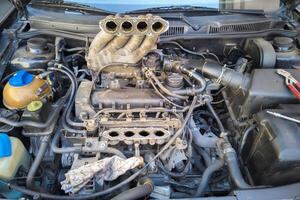 old inline 4 cylinder combustion gasoline engine with dismounted air intake photo