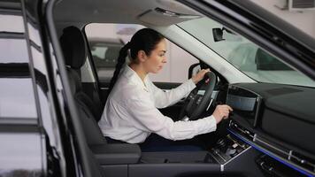 Woman testing car touchscreen and dashboard controls video