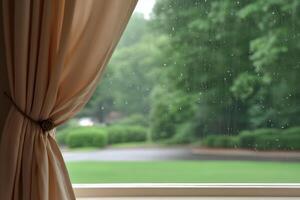 Rain drops running down window with curtain. Rainy day background with copy space. photo