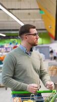 Man selecting fresh bread in a supermarket bakery section video