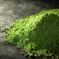 Moringa powder placed on dark countertop for healthy cooking photo