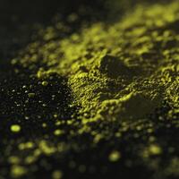 Moringa powder artfully spread across a dark surface photo