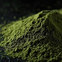 Moringa powder in a close-up view revealing its vibrant green color photo